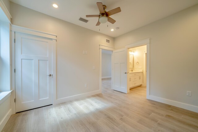 116 E Georgie Pt, Washington, FL 32459 - unfurnished bedroom with light wood-style flooring, recessed lighting, connected bathroom, ceiling fan, and a closet