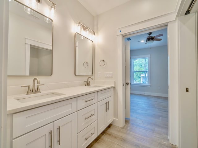 116 E Georgie Pt, Washington, FL 32459 - bathroom featuring double vanity, wood finished floors, and a ceiling fan