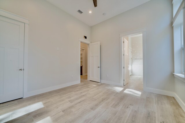 116 E Georgie Pt, Washington, FL 32459 - unfurnished bedroom featuring light wood finished floors, a closet, connected bathroom, and recessed lighting