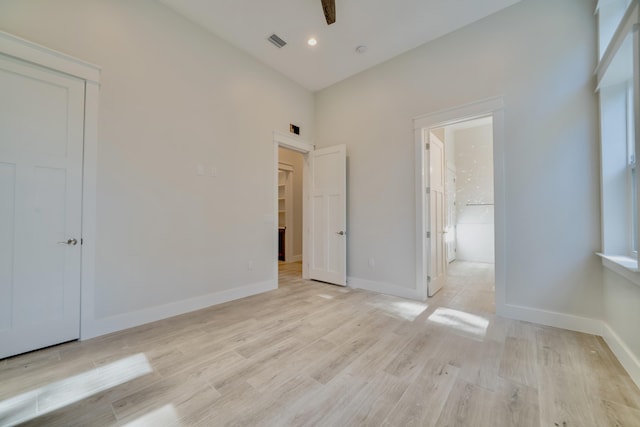 116 E Georgie Pt, Washington, FL 32459 - unfurnished bedroom featuring light wood finished floors, a closet, connected bathroom, and recessed lighting