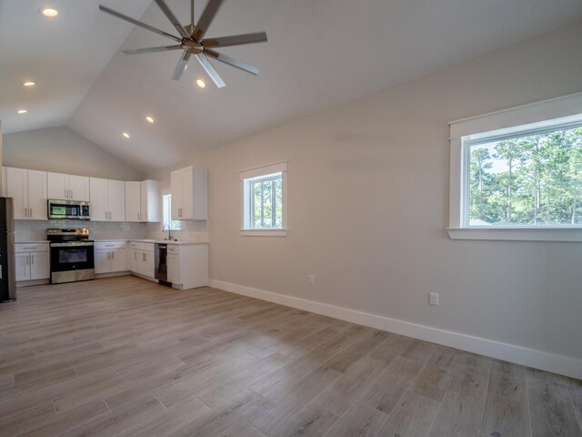116 E Georgie Pt, Washington, FL 32459 - kitchen with stainless steel appliances, ceiling fan, open floor plan, white cabinets, and light countertops