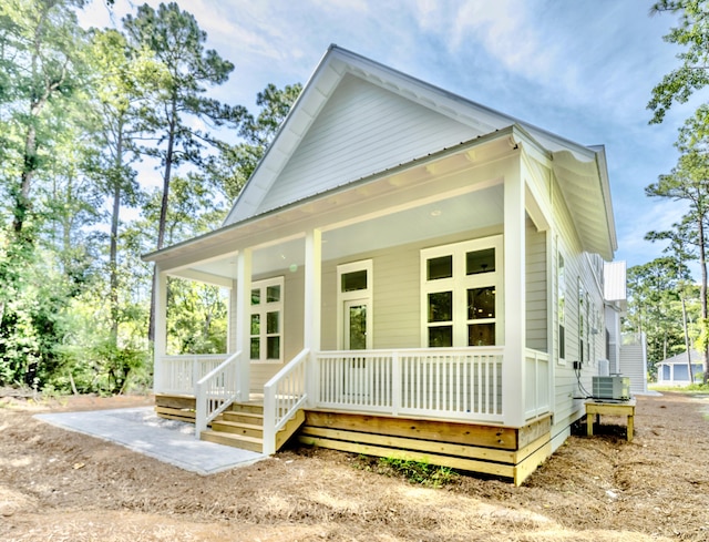 116 E Georgie Pt, Washington, FL 32459 - view of front of house with a porch and a metal roof