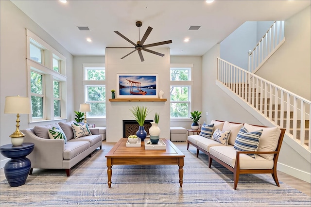 116 E Georgie Pt, Washington, FL 32459 - living room featuring a ceiling fan, stairs, a fireplace, recessed lighting, and wood finished floors