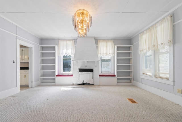 273 E Live Oak Ave, Defuniak Springs, FL 32435 - unfurnished living room with a fireplace, a chandelier, crown molding, and carpet