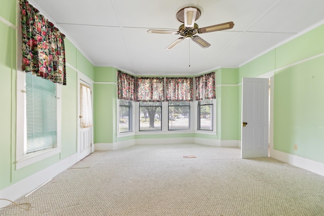 273 E Live Oak Ave, Defuniak Springs, FL 32435 - carpeted empty room with crown molding and ceiling fan