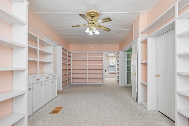 273 E Live Oak Ave, Defuniak Springs, FL 32435 - spacious closet featuring a ceiling fan and light carpet