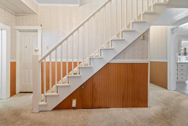 273 E Live Oak Ave, Defuniak Springs, FL 32435 - stairs with wallpapered walls, carpet floors, a wainscoted wall, and crown molding