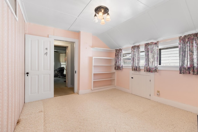 273 E Live Oak Ave, Defuniak Springs, FL 32435 - carpeted empty room with vaulted ceiling and baseboards