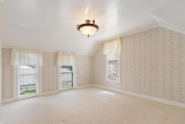 273 E Live Oak Ave, Defuniak Springs, FL 32435 - additional living space featuring lofted ceiling, healthy amount of natural light, carpet floors, and wallpapered walls