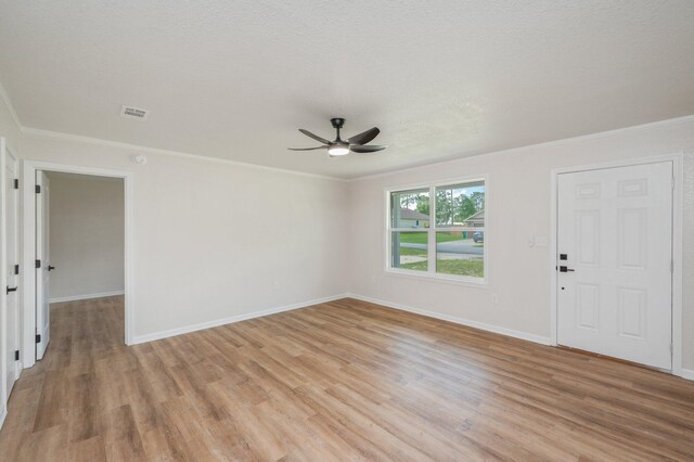 3375 Mclain Dr, Crestview, FL 32539 - unfurnished room with a ceiling fan, light wood finished floors, and crown molding