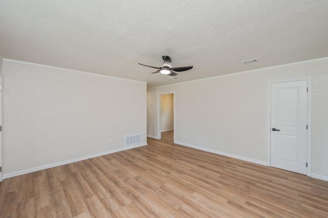 3375 Mclain Dr, Crestview, FL 32539 - spare room featuring light wood-type flooring, a ceiling fan, crown molding, and a textured ceiling