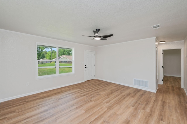 3375 Mclain Dr, Crestview, FL 32539 - spare room with light wood-style flooring, crown molding, ceiling fan, and a textured ceiling