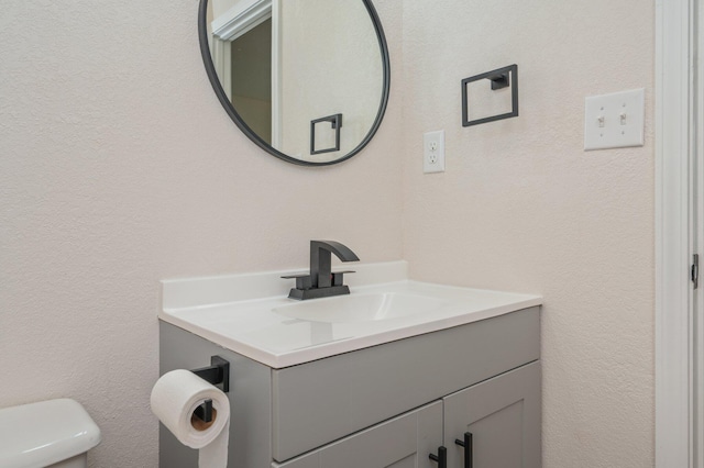 3375 Mclain Dr, Crestview, FL 32539 - half bath featuring vanity and a textured wall