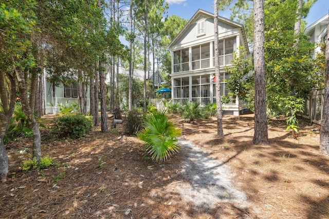 58 Pine Needle Way, Santa Rosa Beach, FL 32459 - back of property with a sunroom