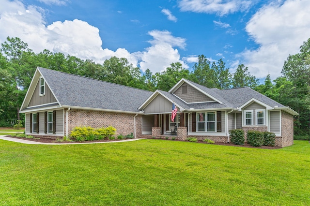 2580 Taylor Rd, Crestview, FL 32536 - craftsman-style house with brick siding, a front lawn, and board and batten siding