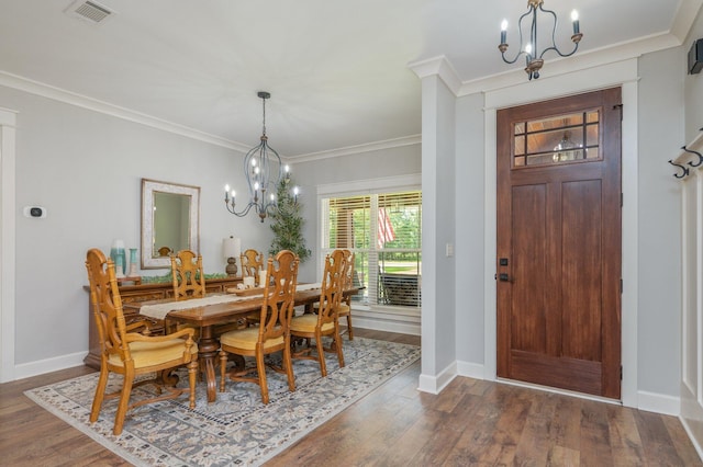 2580 Taylor Rd, Crestview, FL 32536 - dining space featuring a chandelier, dark wood-style floors, and ornamental molding