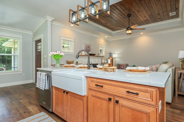 2580 Taylor Rd, Crestview, FL 32536 - kitchen with open floor plan, a tray ceiling, dark wood-style floors, ornamental molding, and light countertops