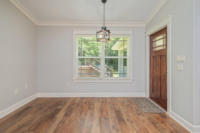 2580 Taylor Rd, Crestview, FL 32536 - foyer with crown molding, a chandelier, and wood finished floors