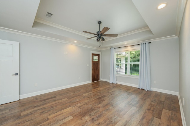 2580 Taylor Rd, Crestview, FL 32536 - empty room featuring a raised ceiling, ornamental molding, a ceiling fan, wood finished floors, and recessed lighting