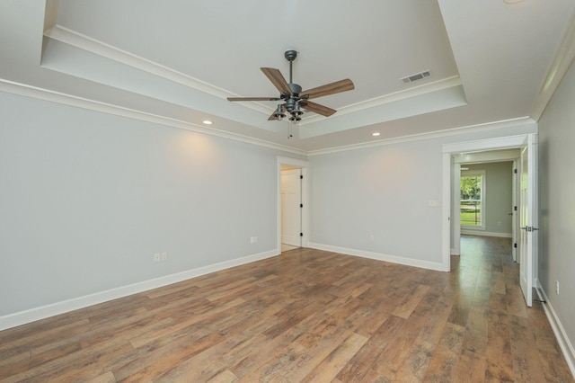 2580 Taylor Rd, Crestview, FL 32536 - unfurnished room with a raised ceiling, a ceiling fan, wood finished floors, ornamental molding, and recessed lighting