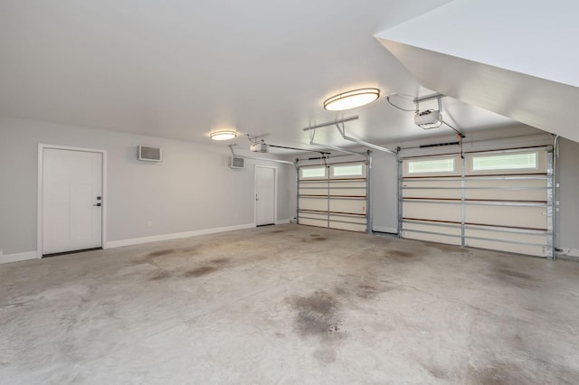 2580 Taylor Rd, Crestview, FL 32536 - garage featuring a garage door opener and an AC wall unit