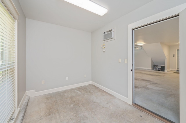 2580 Taylor Rd, Crestview, FL 32536 - spare room featuring a wall mounted AC and concrete flooring