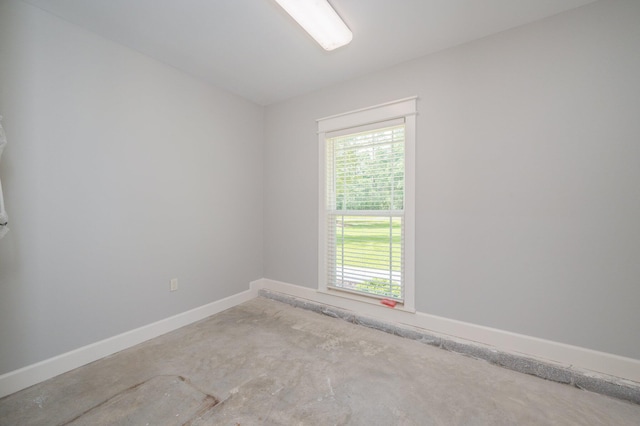 2580 Taylor Rd, Crestview, FL 32536 - empty room with baseboards and concrete flooring