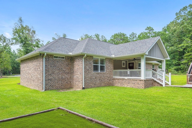 2580 Taylor Rd, Crestview, FL 32536 - view of front facade with a porch, roof with shingles, brick siding, and a front yard
