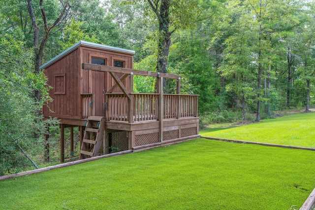 2580 Taylor Rd, Crestview, FL 32536 - view of green lawn with a wooden deck and a view of trees
