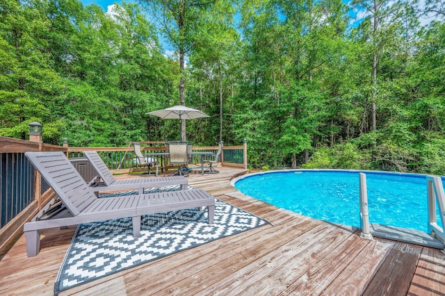 2580 Taylor Rd, Crestview, FL 32536 - swimming pool featuring outdoor dining area and a wooden deck