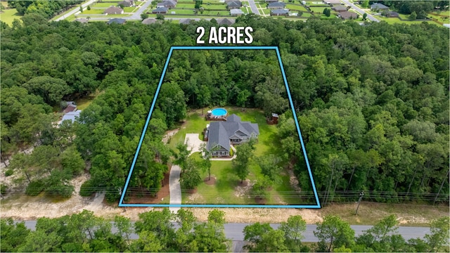 2580 Taylor Rd, Crestview, FL 32536 - aerial overview of property's location with property parcel outlined and a heavily wooded area