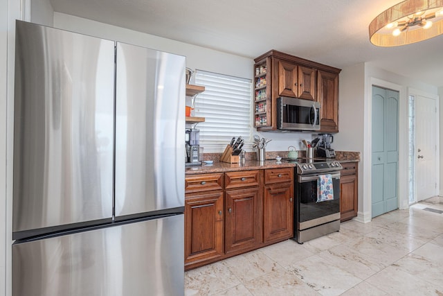 955 Scenic Gulf Dr Unit 350, Miramar Beach, FL 32550 - kitchen with stainless steel appliances, open shelves, stone counters, and brown cabinetry