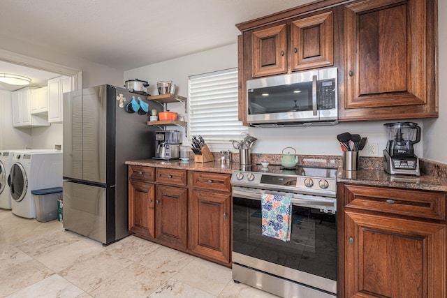 955 Scenic Gulf Dr Unit 350, Miramar Beach, FL 32550 - kitchen with appliances with stainless steel finishes, independent washer and dryer, dark stone counters, and open shelves