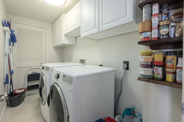 955 Scenic Gulf Dr Unit 350, Miramar Beach, FL 32550 - laundry room featuring washer and dryer, cabinet space, and light tile patterned floors