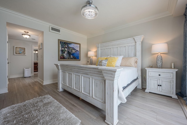 955 Scenic Gulf Dr Unit 350, Miramar Beach, FL 32550 - bedroom with ornamental molding, light wood-style flooring, and a chandelier
