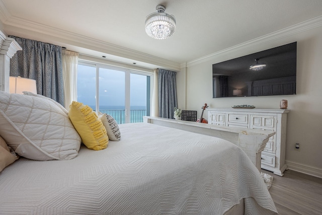 955 Scenic Gulf Dr Unit 350, Miramar Beach, FL 32550 - bedroom featuring crown molding, access to outside, wood finished floors, and a chandelier