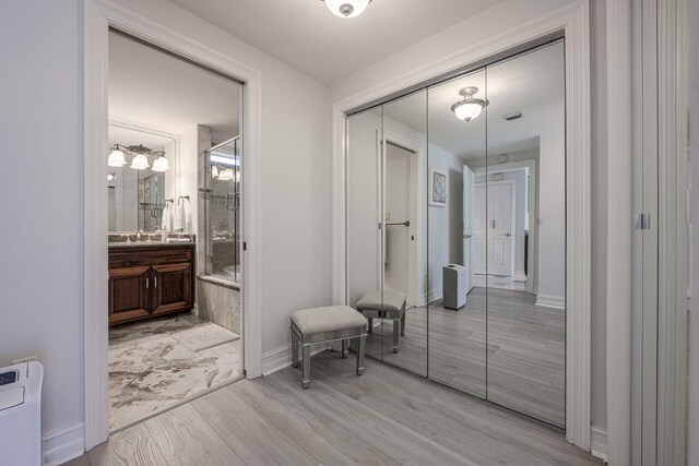 955 Scenic Gulf Dr Unit 350, Miramar Beach, FL 32550 - hallway featuring light wood-style floors and baseboards