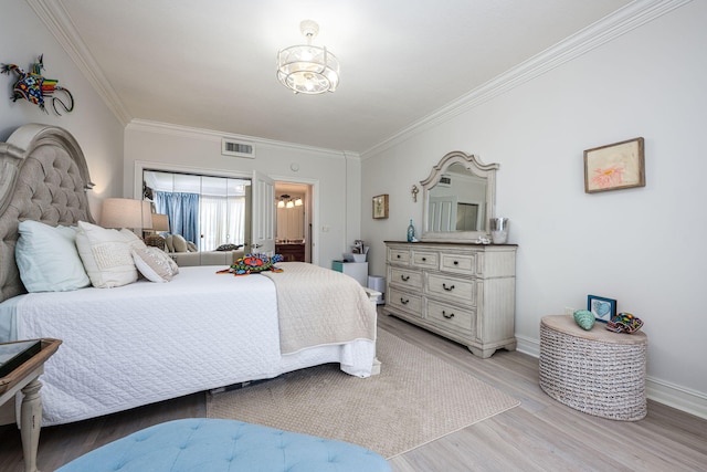 955 Scenic Gulf Dr Unit 350, Miramar Beach, FL 32550 - bedroom with ornamental molding, a chandelier, and light wood-style floors