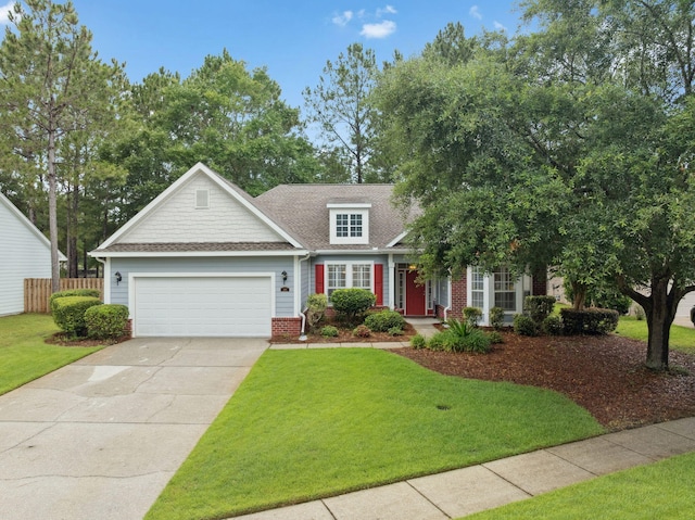 419 Symphony Way, Freeport, FL 32439 - view of front of property featuring an attached garage, driveway, roof with shingles, and brick siding