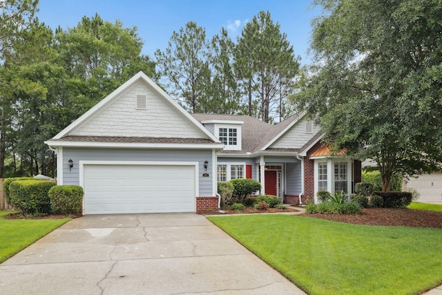 419 Symphony Way, Freeport, FL 32439 - view of front of property featuring an attached garage, a front yard, driveway, and roof with shingles