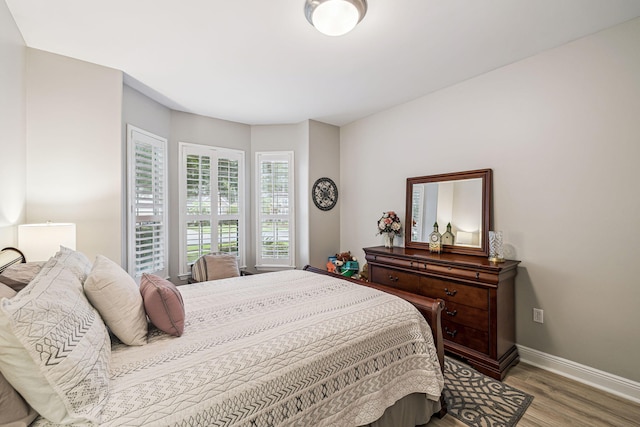 419 Symphony Way, Freeport, FL 32439 - bedroom featuring wood finished floors and baseboards