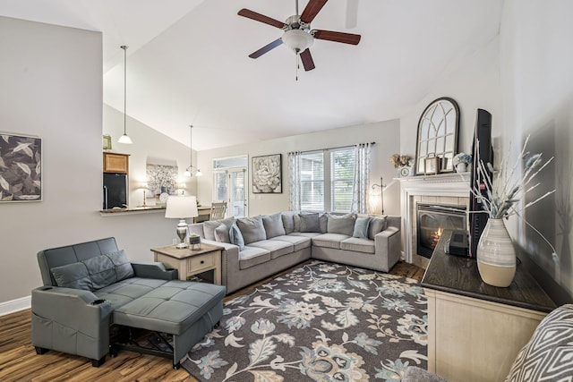 419 Symphony Way, Freeport, FL 32439 - living room featuring wood finished floors, a ceiling fan, a fireplace, and high vaulted ceiling