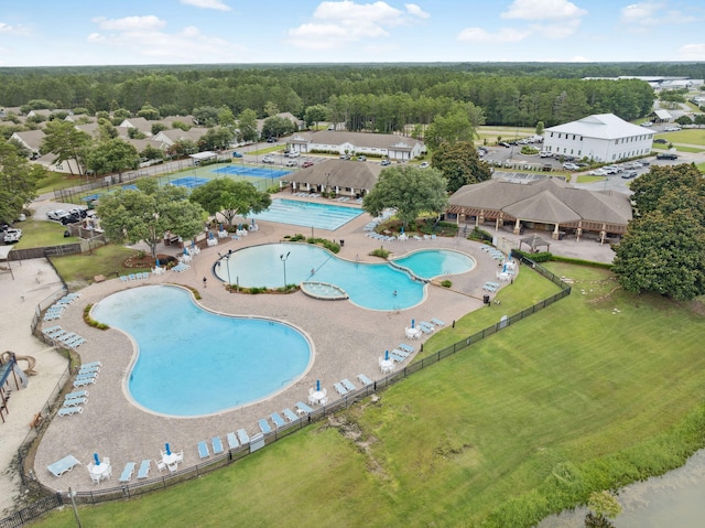419 Symphony Way, Freeport, FL 32439 - aerial overview of property's location featuring a pool area and a heavily wooded area