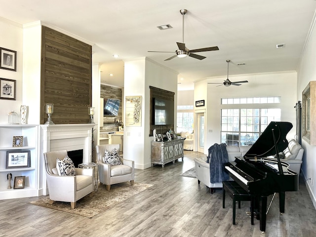 83 Azure Pl, Miramar Beach, FL 32550 - living area with a ceiling fan, ornamental molding, wood finished floors, and a fireplace