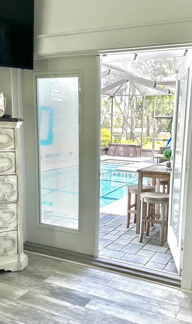 83 Azure Pl, Miramar Beach, FL 32550 - doorway featuring a sunroom and wood finished floors