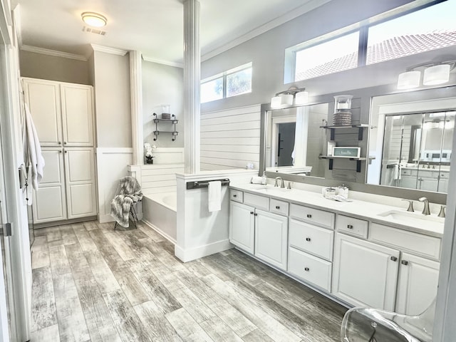 83 Azure Pl, Miramar Beach, FL 32550 - full bath with ornamental molding, double vanity, wood finished floors, and a bath