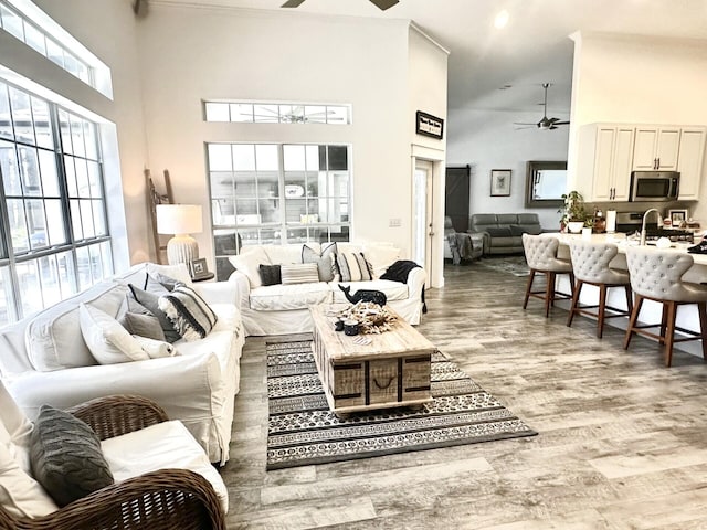 83 Azure Pl, Miramar Beach, FL 32550 - living room with a ceiling fan, high vaulted ceiling, light wood finished floors, and recessed lighting
