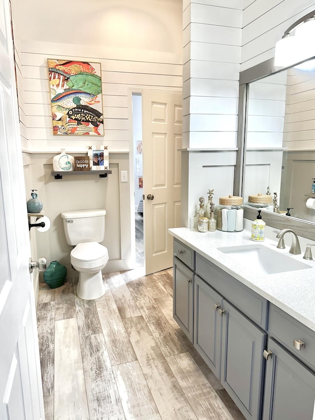 83 Azure Pl, Miramar Beach, FL 32550 - bathroom with wood finished floors, vanity, and wooden walls