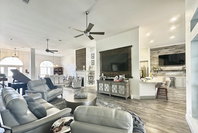 83 Azure Pl, Miramar Beach, FL 32550 - living area with a ceiling fan, a chandelier, recessed lighting, and wood finished floors