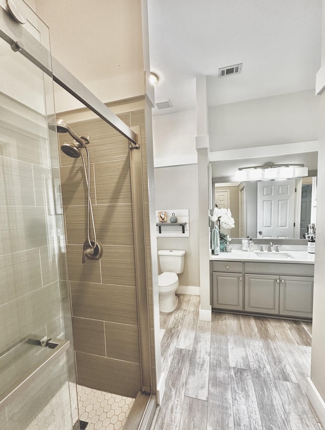 83 Azure Pl, Miramar Beach, FL 32550 - bathroom featuring a shower stall, vanity, and wood finished floors